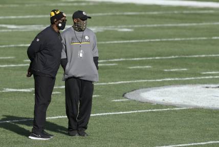 Dec 27, 2020; Pittsburgh, Pennsylvania, USA;  Pittsburgh Steelers assistant head coach John Mitchell (left) and head coach Mike Tomlin (right) look on before the Steelers hit the Indianapolis Colts at Heinz Field. Pittsburgh won 28-24. Mandatory Credit: Charles LeClaire-USA TODAY Sports