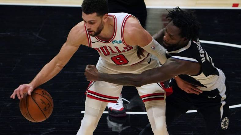 Jan 10, 2021; Los Angeles, California, USA; Chicago Bulls guard Zach LaVine (8) and LA Clippers guard Patrick Beverley (21) battle for the ball in the first half  at Staples Center. Mandatory Credit: Kirby Lee-USA TODAY Sports