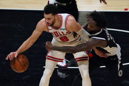 Jan 10, 2021; Los Angeles, California, USA; Chicago Bulls guard Zach LaVine (8) and LA Clippers guard Patrick Beverley (21) battle for the ball in the first half  at Staples Center. Mandatory Credit: Kirby Lee-USA TODAY Sports