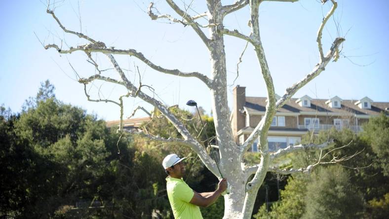 Feb 21, 2021; Pacific Palisades, California, USA; Tony Finau hits from the seventeenth hole tee box during the final round of The Genesis Invitational golf tournament at Riviera Country Club. Mandatory Credit: Gary A. Vasquez-USA TODAY Sports