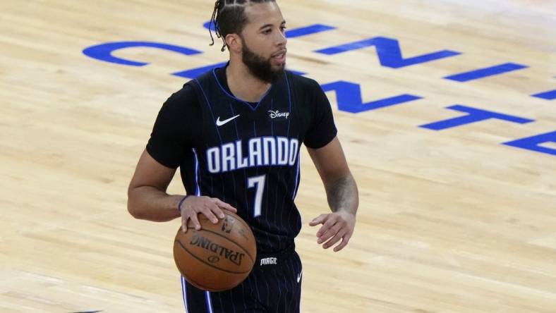 Apr 14, 2021; Chicago, Illinois, USA; Orlando Magic guard Michael Carter-Williams (7) dribbles the ball against the Chicago Bulls during the first quarter at the United Center. Mandatory Credit: Mike Dinovo-USA TODAY Sports