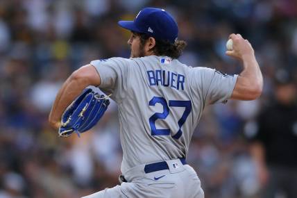 Jun 23, 2021; San Diego, California, USA; Los Angeles Dodgers starting pitcher Trevor Bauer (27) throws a pitch against the San Diego Padres during the first inning at Petco Park. Mandatory Credit: Orlando Ramirez-USA TODAY Sports