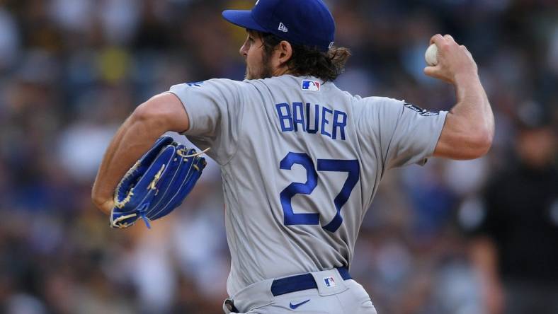 Jun 23, 2021; San Diego, California, USA; Los Angeles Dodgers starting pitcher Trevor Bauer (27) throws a pitch against the San Diego Padres during the first inning at Petco Park. Mandatory Credit: Orlando Ramirez-USA TODAY Sports