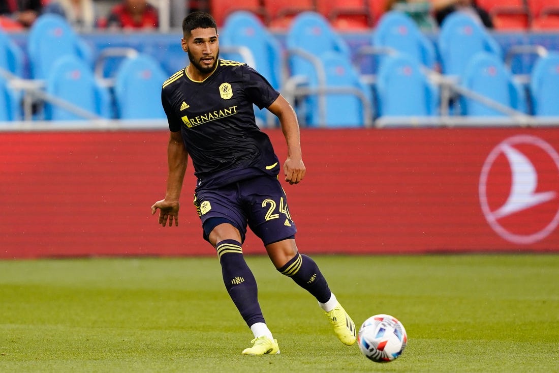 Aug 1, 2021; Toronto, Ontario, CAN; Nashville SC defender Robert Castellanos (24) passes the ball against Toronto FC at BMO Field. Mandatory Credit: Kevin Sousa-USA TODAY Sports