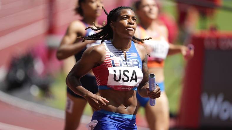 Aug 5, 2021; Tokyo, Japan; Aleia Hobbs (USA) crosses the finish line after competing in the women's 4x100m relay round 1 heat 1 during the Tokyo 2020 Summer Olympic Games at Olympic Stadium. Mandatory Credit: Andrew Nelles-USA TODAY Sports