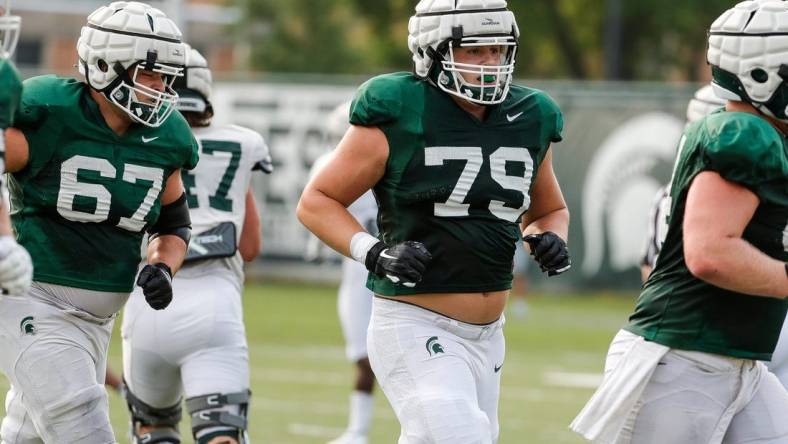 Michigan State offensive tackle Jarrett Horst (79) runs off the field after a drill Wednesday, Aug. 11, 2021 at the team's practice facility in East Lansing.