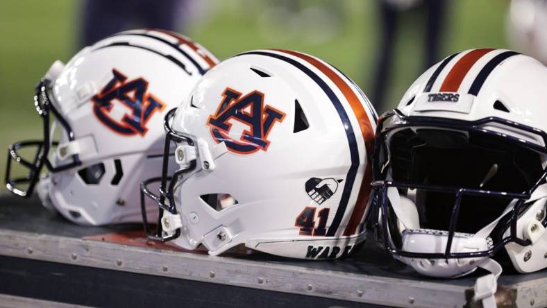 Oct 2, 2021; Baton Rouge, Louisiana, USA; Auburn Tigers helmets sits on a crate during a game against LSU Tigers at Tiger Stadium. Mandatory Credit: Stephen Lew-USA TODAY Sports