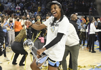 Oct 17, 2021; Chicago, Illinois, USA; Chicago Sky guard Diamond DeShields, dances with the championship trophy after the Chicago Sky beat the Phoenix Mercury 80-74 in game four of the 2021 WNBA Finals at Wintrust Arena. Mandatory Credit: Matt Marton-USA TODAY Sports
