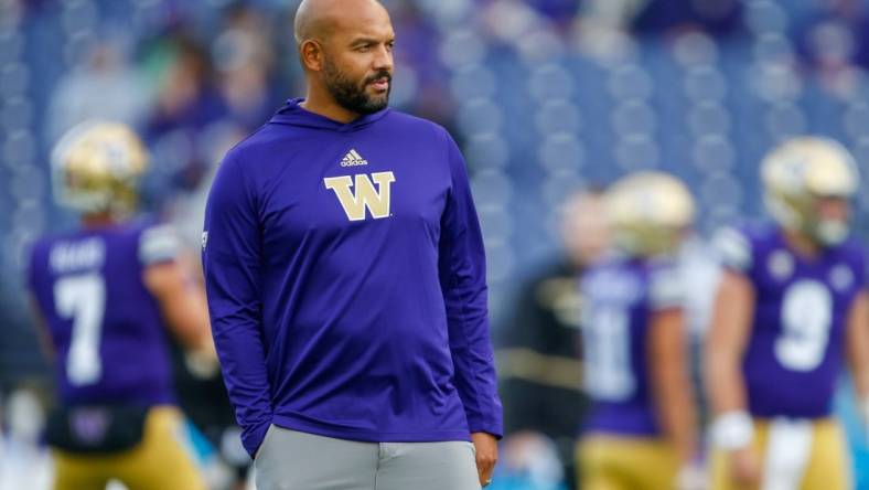 Oct 16, 2021; Seattle, Washington, USA; Washington Huskies head coach Jimmy Lake watches pregame warmups against the UCLA Bruins at Alaska Airlines Field at Husky Stadium. Mandatory Credit: Joe Nicholson-USA TODAY Sports