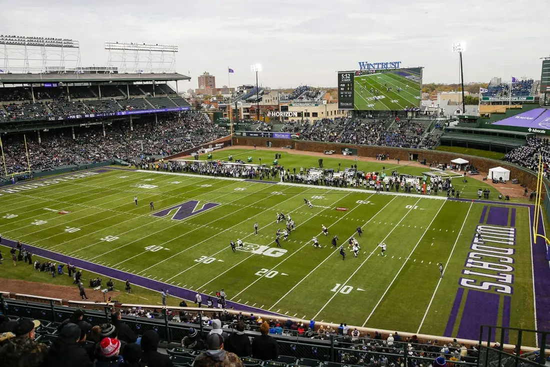 Nov 20, 2021; Chicago, Illinois, USA; A general view as Purdue Boilermakers punter Jack Ansell (30) punts the ball against the Northwestern Wildcats during the first quarter at Wrigley Field. Mandatory Credit: Jon Durr-USA TODAY Sports