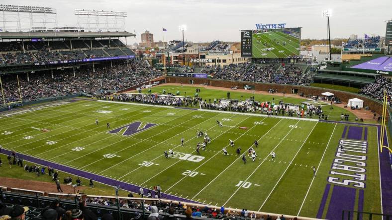 Nov 20, 2021; Chicago, Illinois, USA; A general view as Purdue Boilermakers punter Jack Ansell (30) punts the ball against the Northwestern Wildcats during the first quarter at Wrigley Field. Mandatory Credit: Jon Durr-USA TODAY Sports