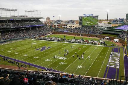 Nov 20, 2021; Chicago, Illinois, USA; A general view as Purdue Boilermakers punter Jack Ansell (30) punts the ball against the Northwestern Wildcats during the first quarter at Wrigley Field. Mandatory Credit: Jon Durr-USA TODAY Sports