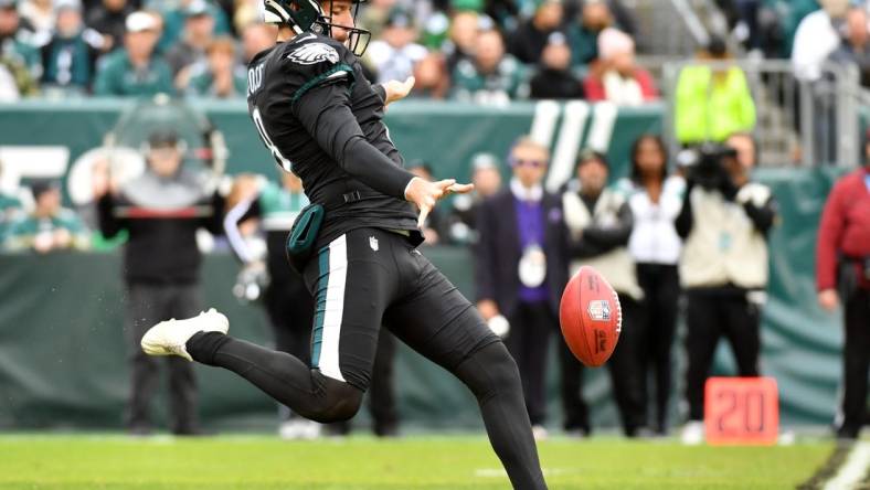 Nov 21, 2021; Philadelphia, Pennsylvania, USA; Philadelphia Eagles punter Arryn Siposs (8) punts against the New Orleans Saints at Lincoln Financial Field. Mandatory Credit: Eric Hartline-USA TODAY Sports