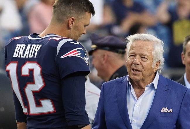 Tom Brady talks with owner Robert Kraft before a preseason game in August 2019.