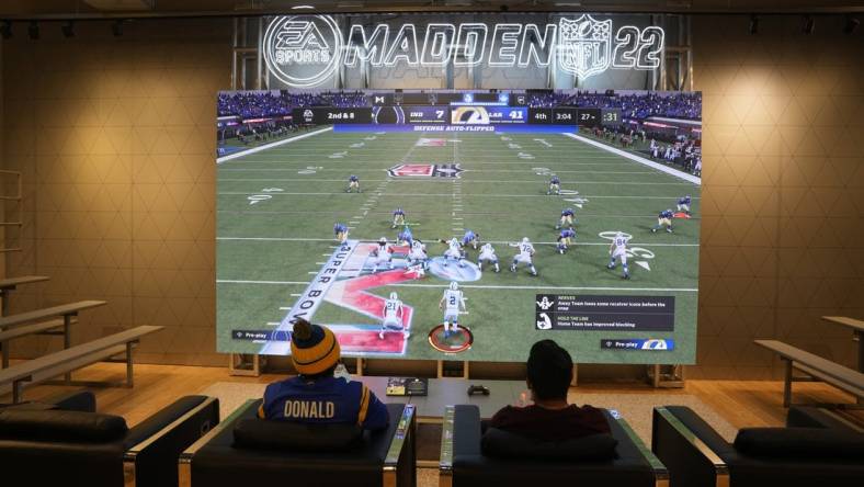 Feb 9, 2022; Los Angeles, CA, USA; People play EA Sports Madden 22 video game at the Nike store at the Grove. Mandatory Credit: Kirby Lee-USA TODAY Sports