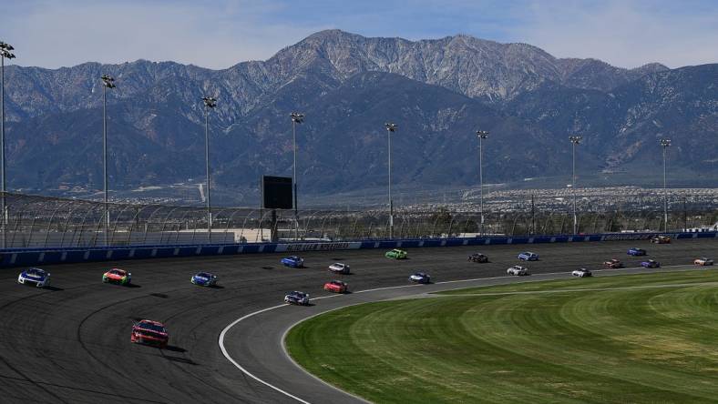 Feb 27, 2022; Fontana, California, USA; General view as NASCAR Cup Series driver Tyler Reddick (8) leads a group during the WISE Power 400 at Auto Club Speedway. Mandatory Credit: Gary A. Vasquez-USA TODAY Sports