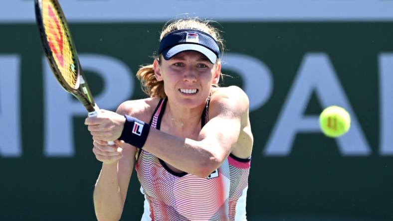 Mar 11, 2022; Indian Wells, CA, USA; Ekaterina Alexandrova (RUS) hits a shot in her 2nd round match against Simona Halep (ROU) at the BNP Paribas Open at the Indian Wells Tennis Garden. Mandatory Credit: Jayne Kamin-Oncea-USA TODAY Sports