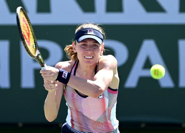 Mar 11, 2022; Indian Wells, CA, USA; Ekaterina Alexandrova (RUS) hits a shot in her 2nd round match against Simona Halep (ROU) at the BNP Paribas Open at the Indian Wells Tennis Garden. Mandatory Credit: Jayne Kamin-Oncea-USA TODAY Sports