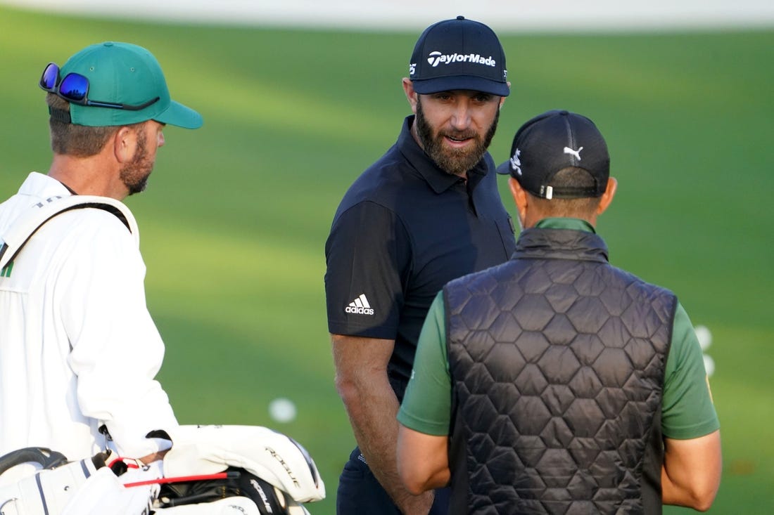 Apr 5, 2022; Augusta, Georgia, USA; Dustin Johnson hits at the practice facility during a practice round of The Masters golf tournament at Augusta National Golf Club. Mandatory Credit: Danielle Parhizkaran-Augusta Chronicle/USA TODAY Network

Golf Masters Tournament Practice Round