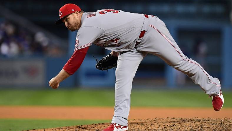 Apr 14, 2022; Los Angeles, California, USA; Cincinnati Reds relief pitcher Justin Wilson (34) throws against the Los Angeles Dodgers during the eighth inning at Dodger Stadium. Mandatory Credit: Gary A. Vasquez-USA TODAY Sports