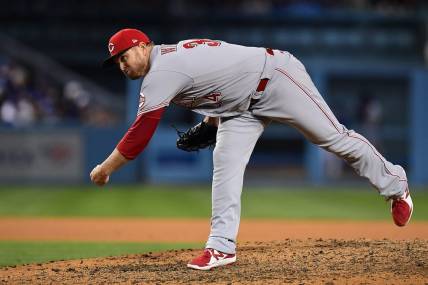 Apr 14, 2022; Los Angeles, California, USA; Cincinnati Reds relief pitcher Justin Wilson (34) throws against the Los Angeles Dodgers during the eighth inning at Dodger Stadium. Mandatory Credit: Gary A. Vasquez-USA TODAY Sports