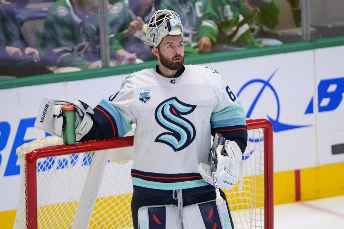 Apr 23, 2022; Dallas, Texas, USA; Seattle Kraken goaltender Chris Driedger (60) waits while the referees check a video review during the first period against the Dallas Stars at the American Airlines Center. Mandatory Credit: Jerome Miron-USA TODAY Sports