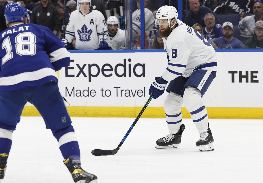 May 6, 2022; Tampa, Florida, USA;Toronto Maple Leafs defenseman Jake Muzzin (8) skates with the puck as Tampa Bay Lightning left wing Ondrej Palat (18) defends during the second period of game three of the first round of the 2022 Stanley Cup Playoffs against the Tampa Bay Lightning at Amalie Arena. Mandatory Credit: Kim Klement-USA TODAY Sports