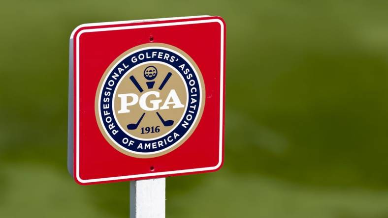 May 26, 2022; Benton Harbor, Michigan, USA; A PGA of America sign stands near the eighth tee box during the first round of the 2022 KitchenAid Senior PGA Championship at Harbor Shores. Mandatory Credit: Raj Mehta-USA TODAY Sports