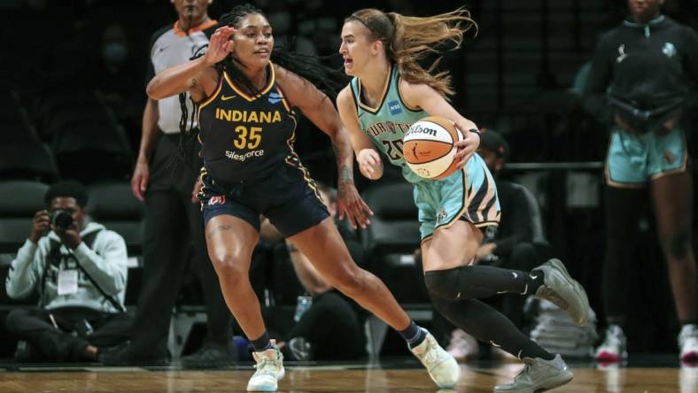 Jun 1, 2022; Brooklyn, New York, USA; New York Liberty guard Sabrina Ionescu (20) drives past Indiana Fever guard Victoria Vivians (35) in the first quarter at Barclays Center. Mandatory Credit: Wendell Cruz-USA TODAY Sports