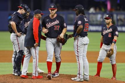 Jun 9, 2022; Miami, Florida, USA; Washington Nationals manager Dave Martinez (4) takes starting pitcher Stephen Strasburg (37) out of the game in the fifth inning against the Miami Marlins at loanDepot Park. Mandatory Credit: Sam Navarro-USA TODAY Sports