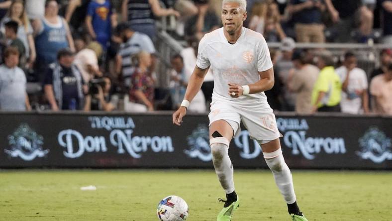 May 28, 2022; Kansas City, Kansas, USA; Sporting Kansas City defender Kortne Ford (12) controls the ball against the Vancouver Whitecaps during the match at Children's Mercy Park. Mandatory Credit: Denny Medley-USA TODAY Sports