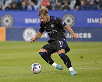 Jun 18, 2022; Montreal, Quebec, CAN; CF Montreal midfielder Matko Miljevic (11) plays the ball during the first half of the game against the Austin FC at Stade Saputo. Mandatory Credit: Eric Bolte-USA TODAY Sports