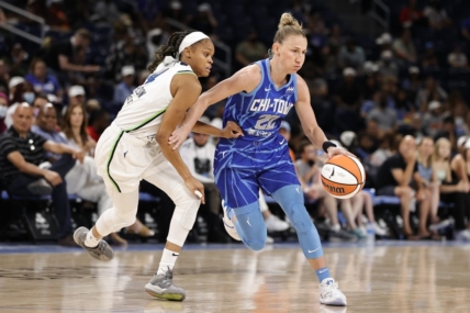 Jun 26, 2022; Chicago, Illinois, USA; Chicago Sky guard Courtney Vandersloot (22) drives to the basket against Minnesota Lynx guard Moriah Jefferson (4) during the first half of a WNBA game at Wintrust Arena. Mandatory Credit: Kamil Krzaczynski-USA TODAY Sports