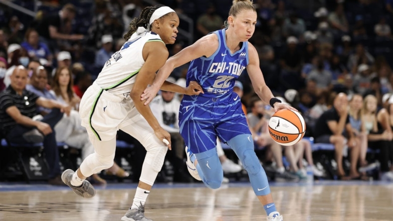 Jun 26, 2022; Chicago, Illinois, USA; Chicago Sky guard Courtney Vandersloot (22) drives to the basket against Minnesota Lynx guard Moriah Jefferson (4) during the first half of a WNBA game at Wintrust Arena. Mandatory Credit: Kamil Krzaczynski-USA TODAY Sports