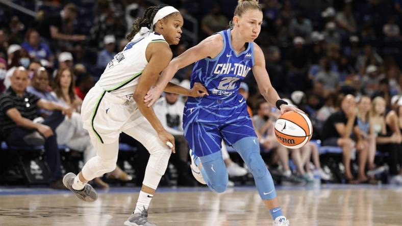 Jun 26, 2022; Chicago, Illinois, USA; Chicago Sky guard Courtney Vandersloot (22) drives to the basket against Minnesota Lynx guard Moriah Jefferson (4) during the first half of a WNBA game at Wintrust Arena. Mandatory Credit: Kamil Krzaczynski-USA TODAY Sports