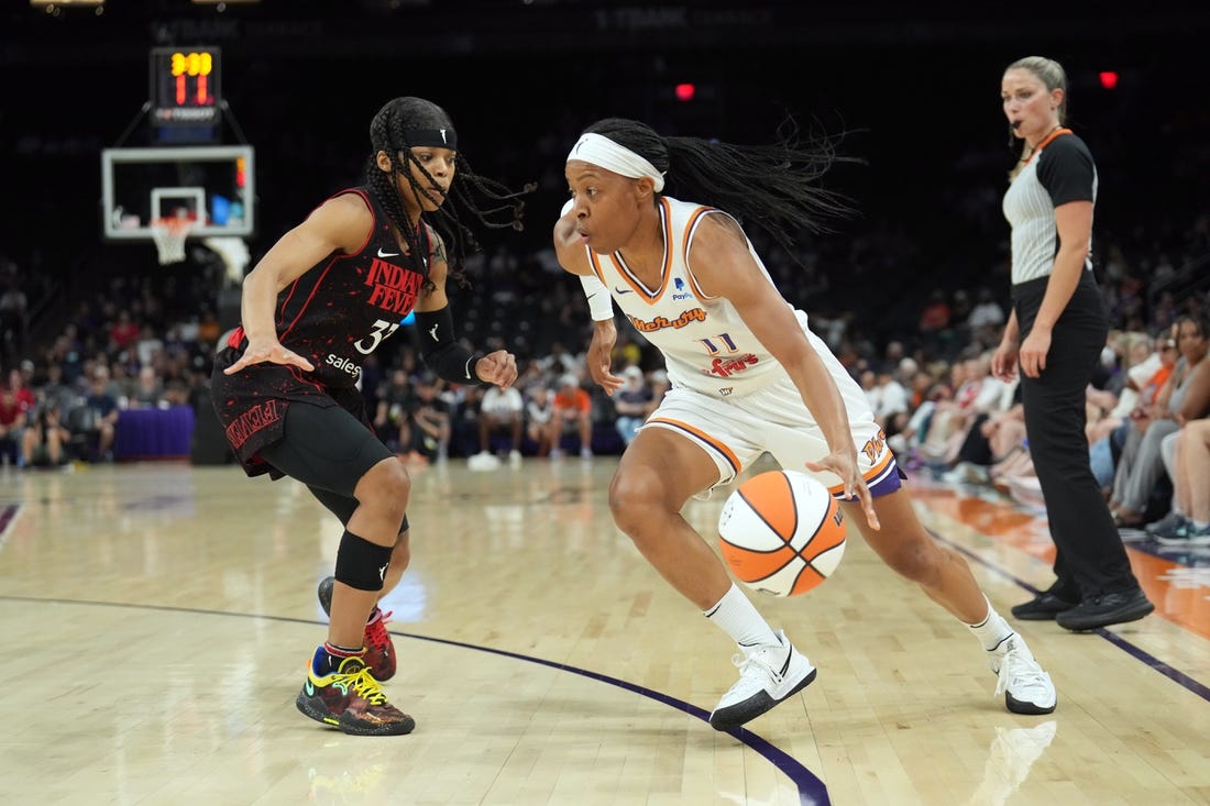 Jun 29, 2022; Phoenix, Arizona, USA; Phoenix Mercury guard Shey Peddy (11) dribbles against Indiana Fever guard Destanni Henderson (33) during the first half at Footprint Center. Mandatory Credit: Joe Camporeale-USA TODAY Sports