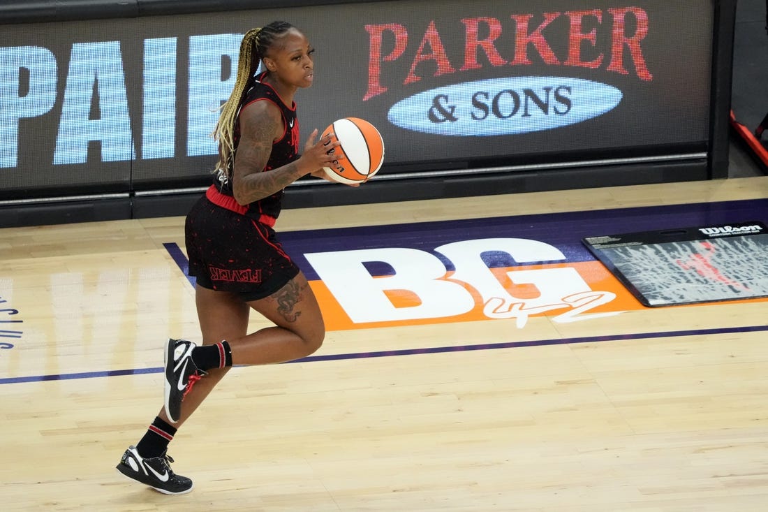 Jun 29, 2022; Phoenix, Arizona, USA; Indiana Fever guard Tiffany Mitchell (25) dribbles by a painted section of the court reading BG 42 in support of Phoenix Mercury center Brittney Griner (not pictured) during the first half at Footprint Center. Mandatory Credit: Joe Camporeale-USA TODAY Sports