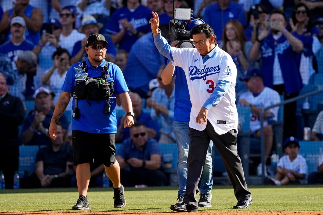 Jul 19, 2022; Los Angeles, California, USA; Los Angeles Dodgers former pitcher Fernando Valenzuela waves to the crowd before throwing a ceremonial first pitch before the 2022 MLB All Star Game at Dodger Stadium. Mandatory Credit: Robert Hanashiro-USA TODAY Sports