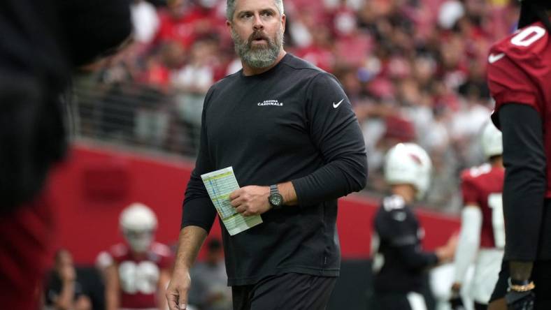 Defensive Line Coach Matt Burke works out his team during the Arizona Cardinals Back Together Saturday Practice at State Farm Stadium in Glendale, Ariz. on Saturday, July 30, 2022.

Cardinals Fan 24