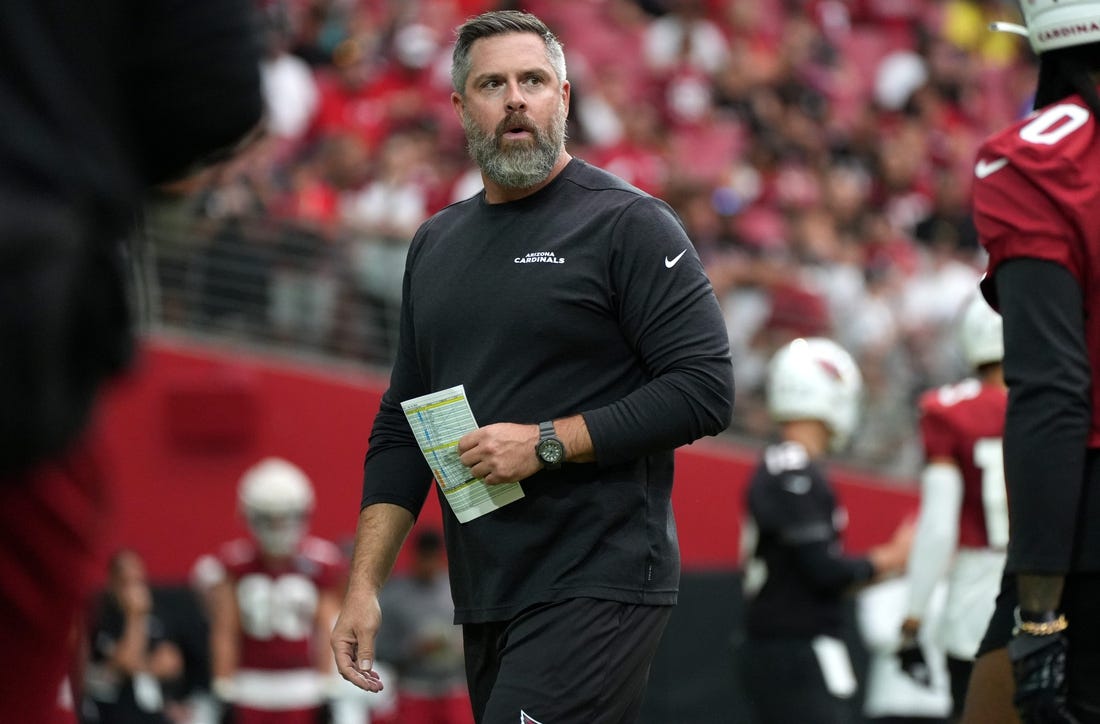 Defensive Line Coach Matt Burke works out his team during the Arizona Cardinals Back Together Saturday Practice at State Farm Stadium in Glendale, Ariz. on Saturday, July 30, 2022.

Cardinals Fan 24