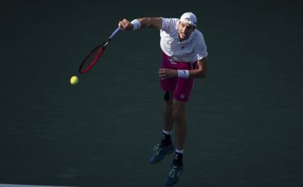 Aug 19, 2022; Cincinnati, OH, USA; John Isner (USA) serves the ball during his match against Stefanos Tsitsipas (GRE) at the Western & Southern Open at the Lindner Family Tennis Center. Mandatory Credit: Susan Mullane-USA TODAY Sports