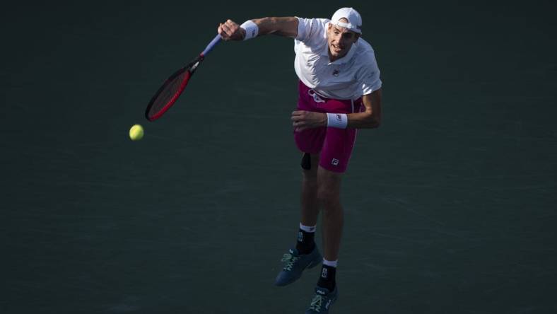 Aug 19, 2022; Cincinnati, OH, USA; John Isner (USA) serves the ball during his match against Stefanos Tsitsipas (GRE) at the Western & Southern Open at the Lindner Family Tennis Center. Mandatory Credit: Susan Mullane-USA TODAY Sports