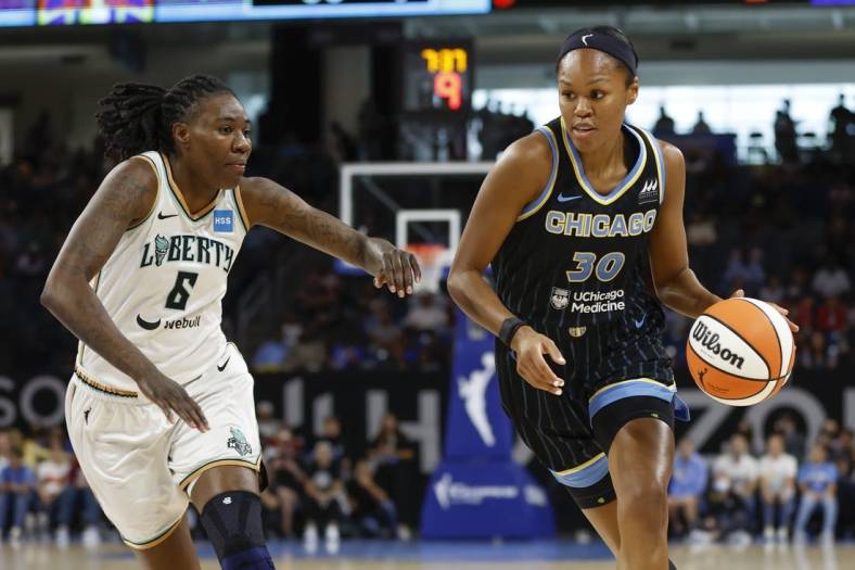 Aug 20, 2022; Chicago, Illinois, USA; Chicago Sky forward Azura Stevens (30) drives to the basket against New York Liberty forward Natasha Howard (6) during the first half of Game 2 of the first round of the WNBA playoffs at Wintrust Arena. Mandatory Credit: Kamil Krzaczynski-USA TODAY Sports