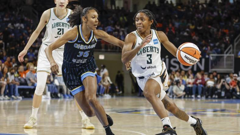 Aug 20, 2022; Chicago, Illinois, USA; New York Liberty guard Crystal Dangerfield (3) drives to the basket against Chicago Sky guard Rebekah Gardner (35) during the second half of Game 2 of the first round of the WNBA playoffs at Wintrust Arena. Mandatory Credit: Kamil Krzaczynski-USA TODAY Sports