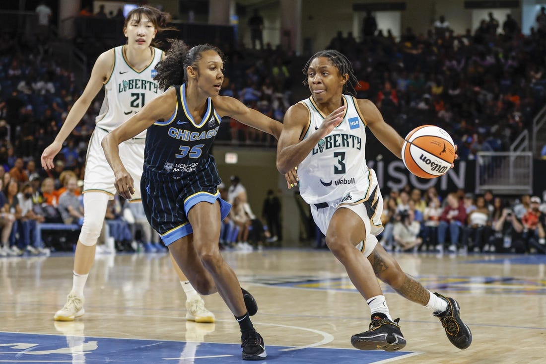 Aug 20, 2022; Chicago, Illinois, USA; New York Liberty guard Crystal Dangerfield (3) drives to the basket against Chicago Sky guard Rebekah Gardner (35) during the second half of Game 2 of the first round of the WNBA playoffs at Wintrust Arena. Mandatory Credit: Kamil Krzaczynski-USA TODAY Sports