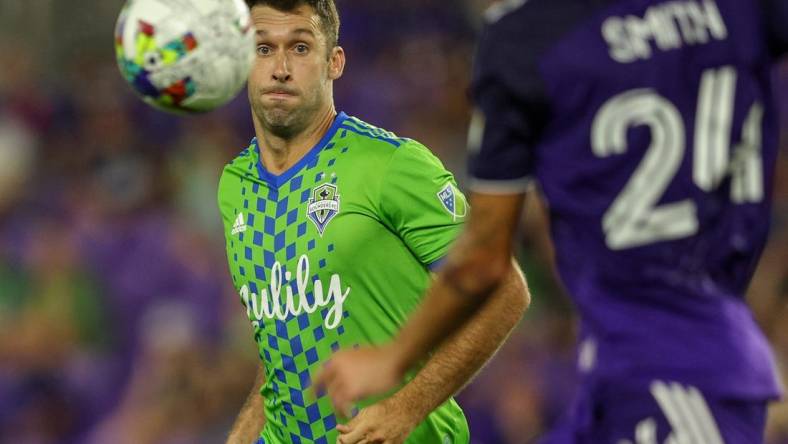 Aug 31, 2022; Orlando, Florida, USA;  Seattle Sounders defender Will Bruin (17) tracks down ball against Orlando City in the second half at Exploria Stadium. Mandatory Credit: Nathan Ray Seebeck-USA TODAY Sports