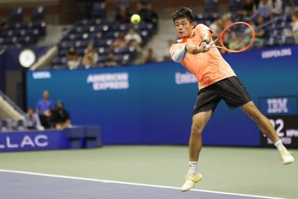 Sep 2, 2022; Flushing, NY, USA; Yibing Wu (CHN) hits a backhand against Daniil Medvedev (not pictured) on day five of the 2022 U.S. Open tennis tournament at USTA Billie Jean King Tennis Center. Mandatory Credit: Geoff Burke-USA TODAY Sports