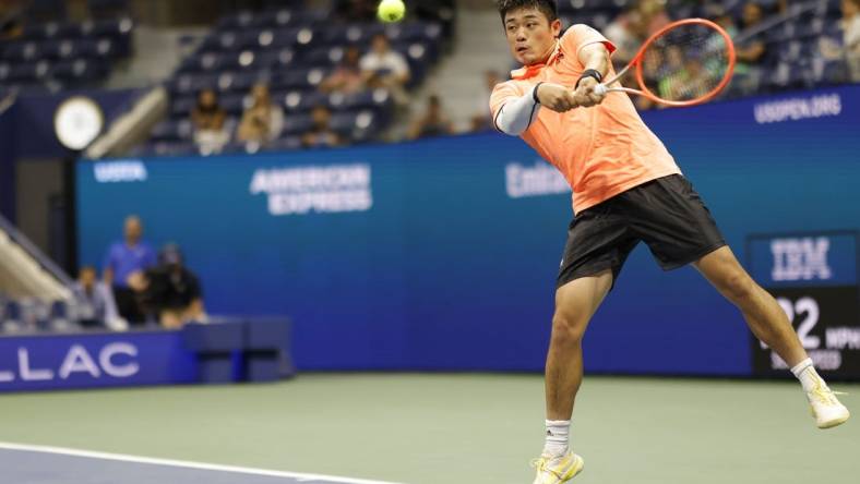 Sep 2, 2022; Flushing, NY, USA; Yibing Wu (CHN) hits a backhand against Daniil Medvedev (not pictured) on day five of the 2022 U.S. Open tennis tournament at USTA Billie Jean King Tennis Center. Mandatory Credit: Geoff Burke-USA TODAY Sports