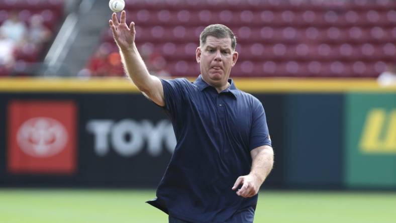 Sep 4, 2022; Cincinnati, Ohio, USA; United States Secretary of Labor Marty Walsh throws a first pitch prior to a game with the Colorado Rockies and the Cincinnati Reds at Great American Ball Park. Mandatory Credit: David Kohl-USA TODAY Sports