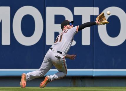 Sep 7, 2022; Los Angeles, California, USA;  San Francisco Giants right fielder Luis Gonzalez (51) makes a catch off a ball hit by Los Angeles Dodgers third baseman Miguel Vargas (not pictured) in the fourth inning at Dodger Stadium. Mandatory Credit: Jayne Kamin-Oncea-USA TODAY Sports